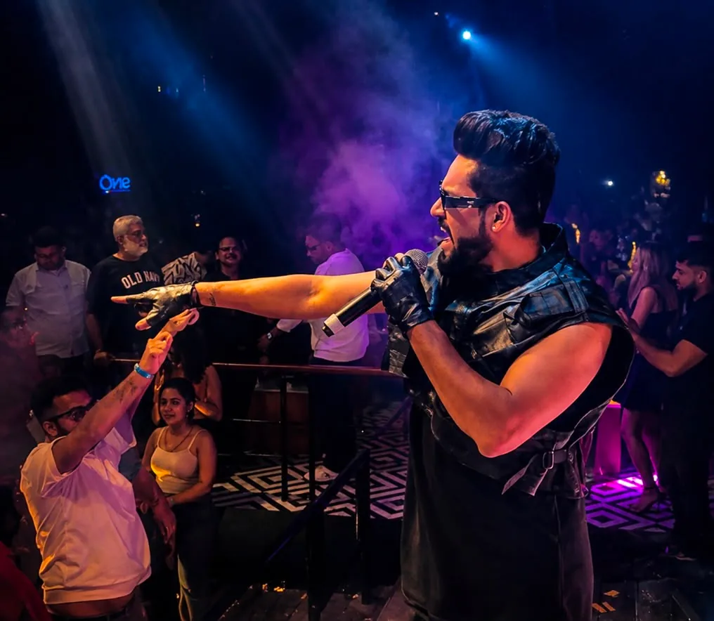 KKsonic live at a club with purple stage lighting