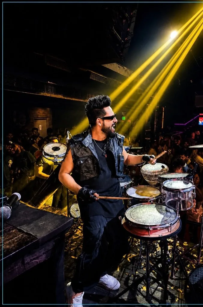 KKsonic live drumming with yellow stage lighting